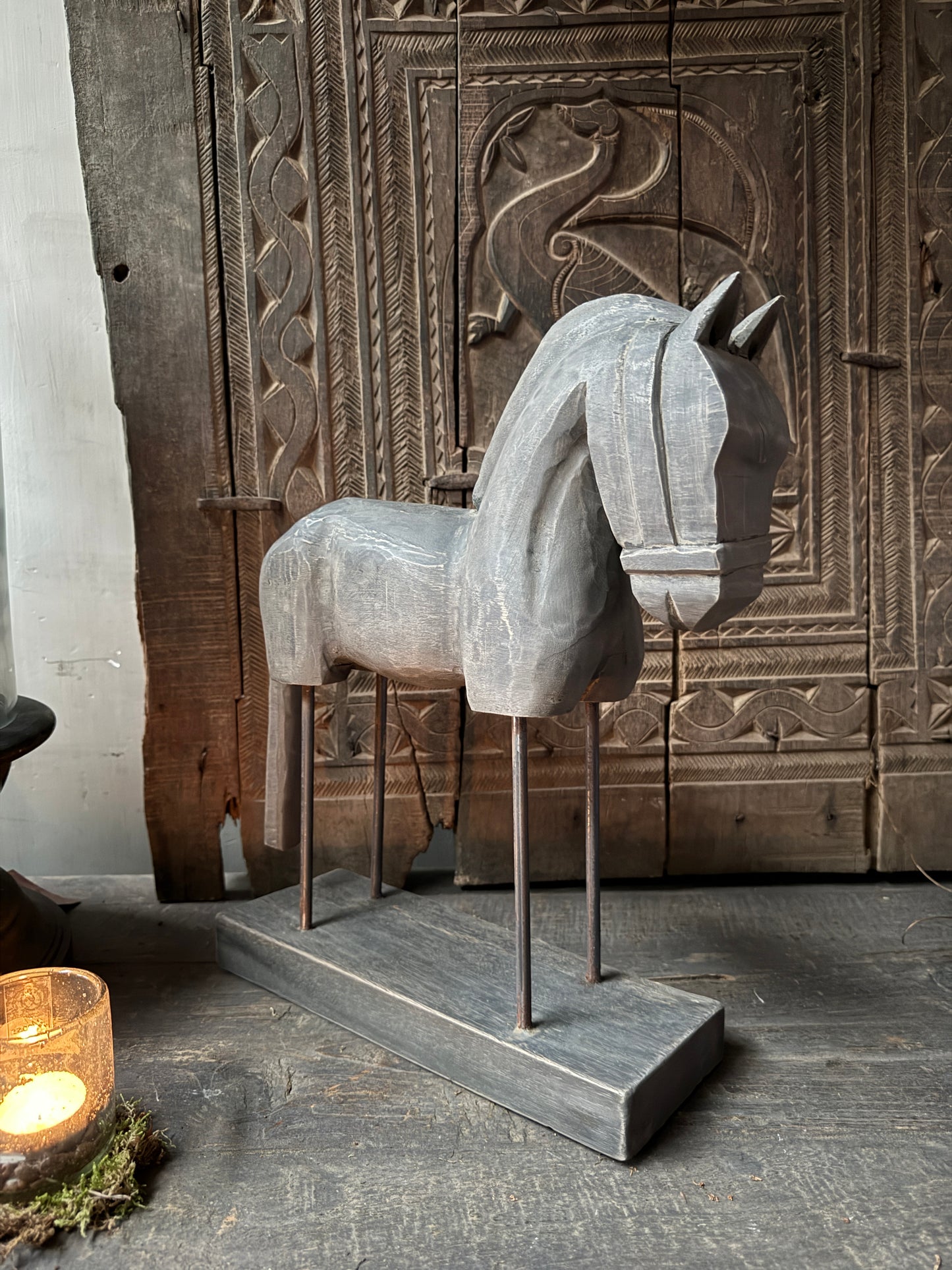 Wooden horse on stand